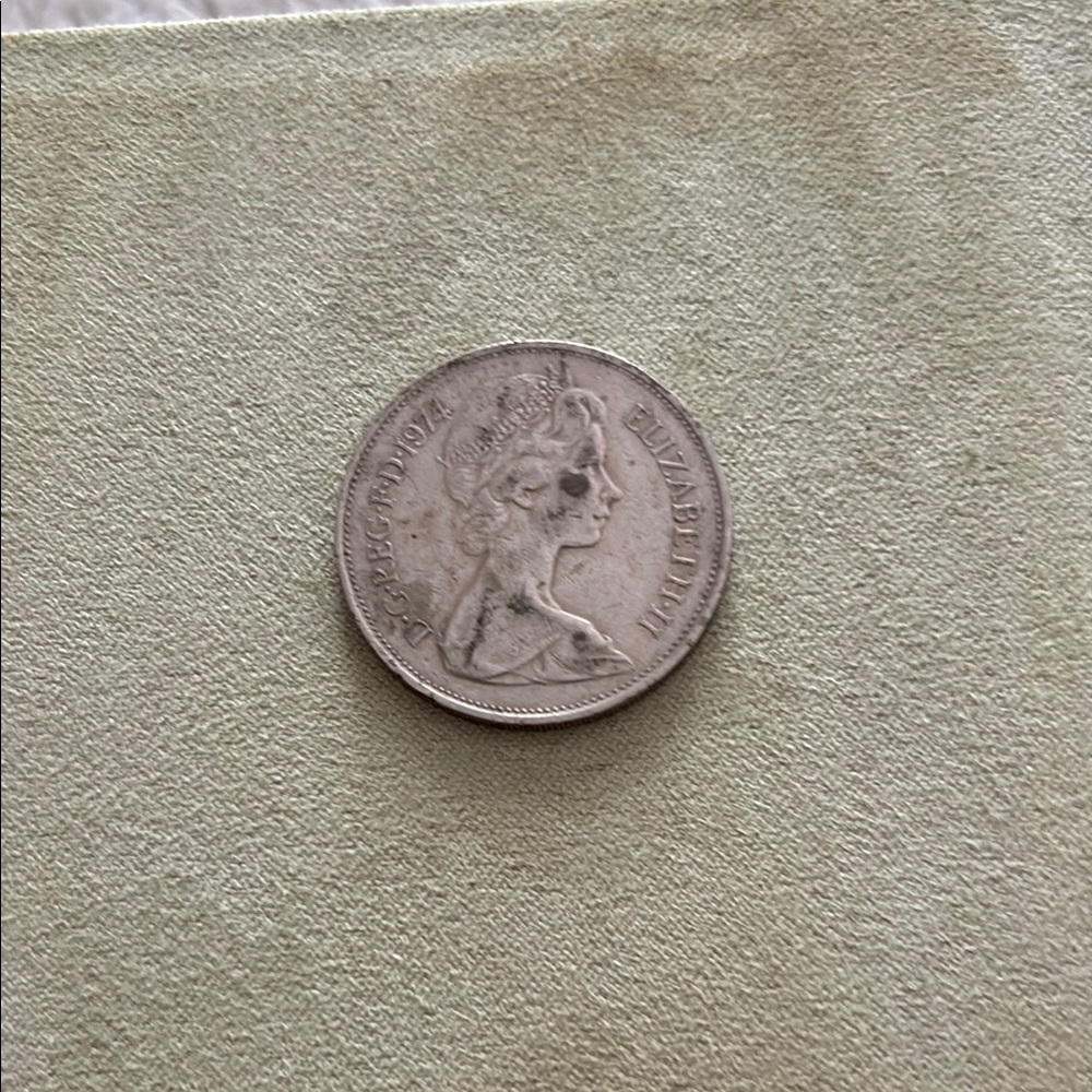 Vintage Coin with Queen Portrait